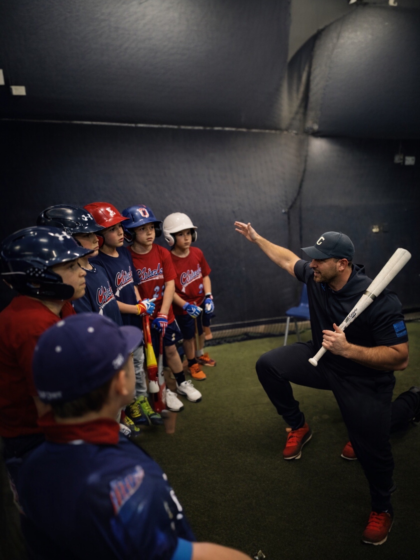 Coach Steve breaking down a swing for a youth team